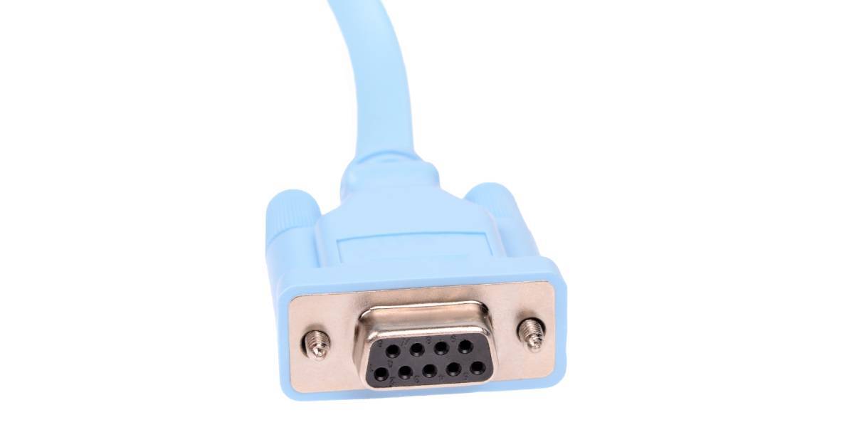 The end of a RS232 connector on a white background. The exterior of the cable is light blue.